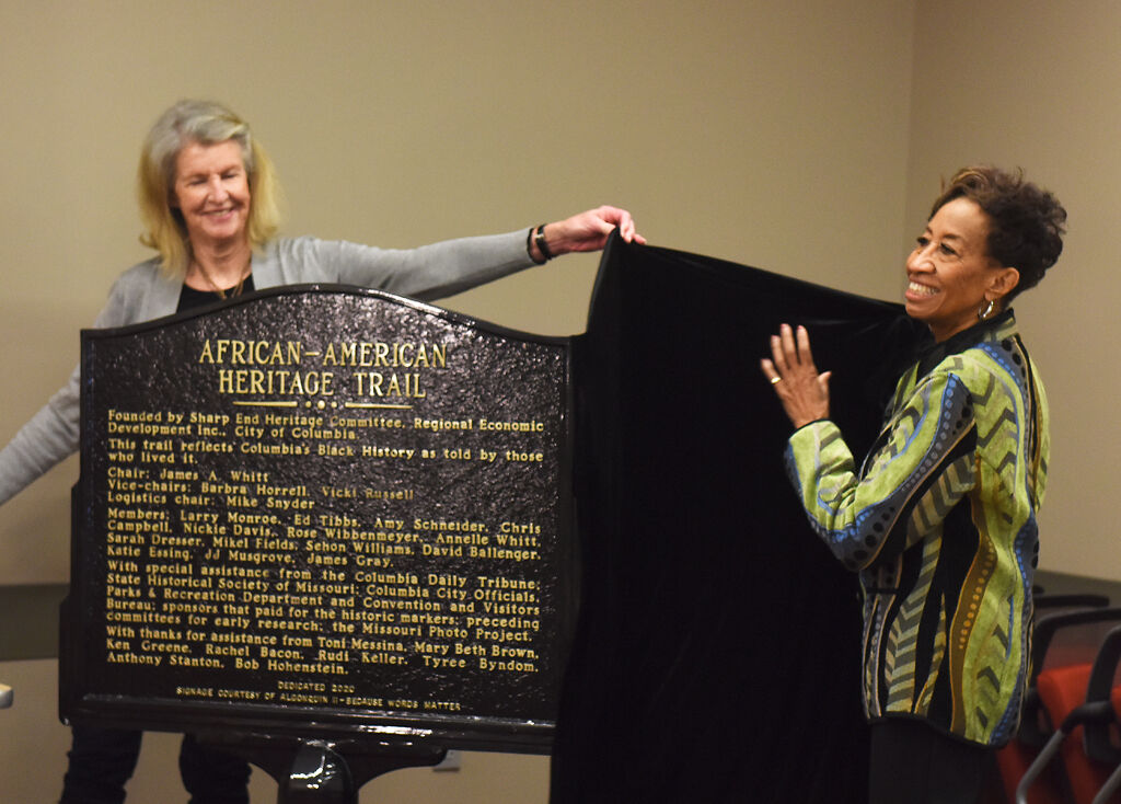 Vicki Russell and Barbra Horrell unveil the African American Heritage Trail marker
